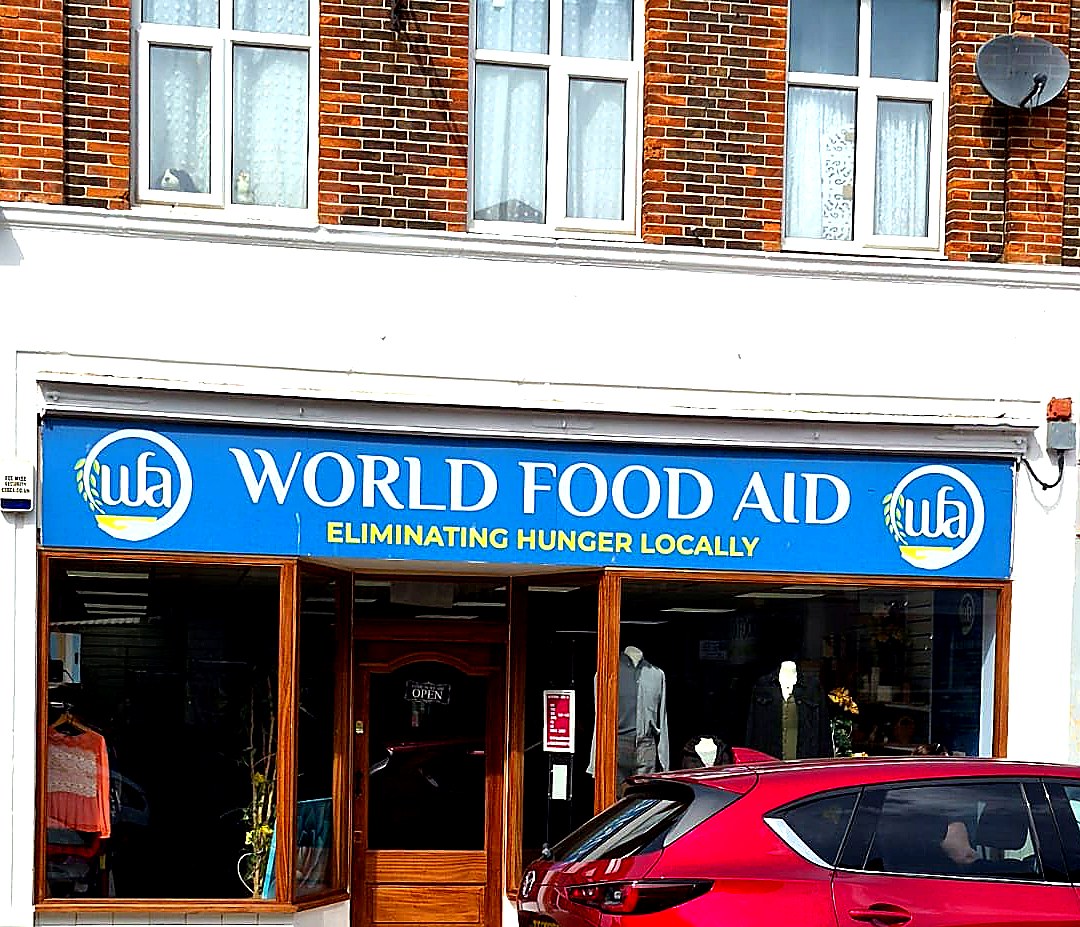 World Food Aid shopfront, Clacton-on-Sea — full frontage view showing timber frame, signage and brick upper floor