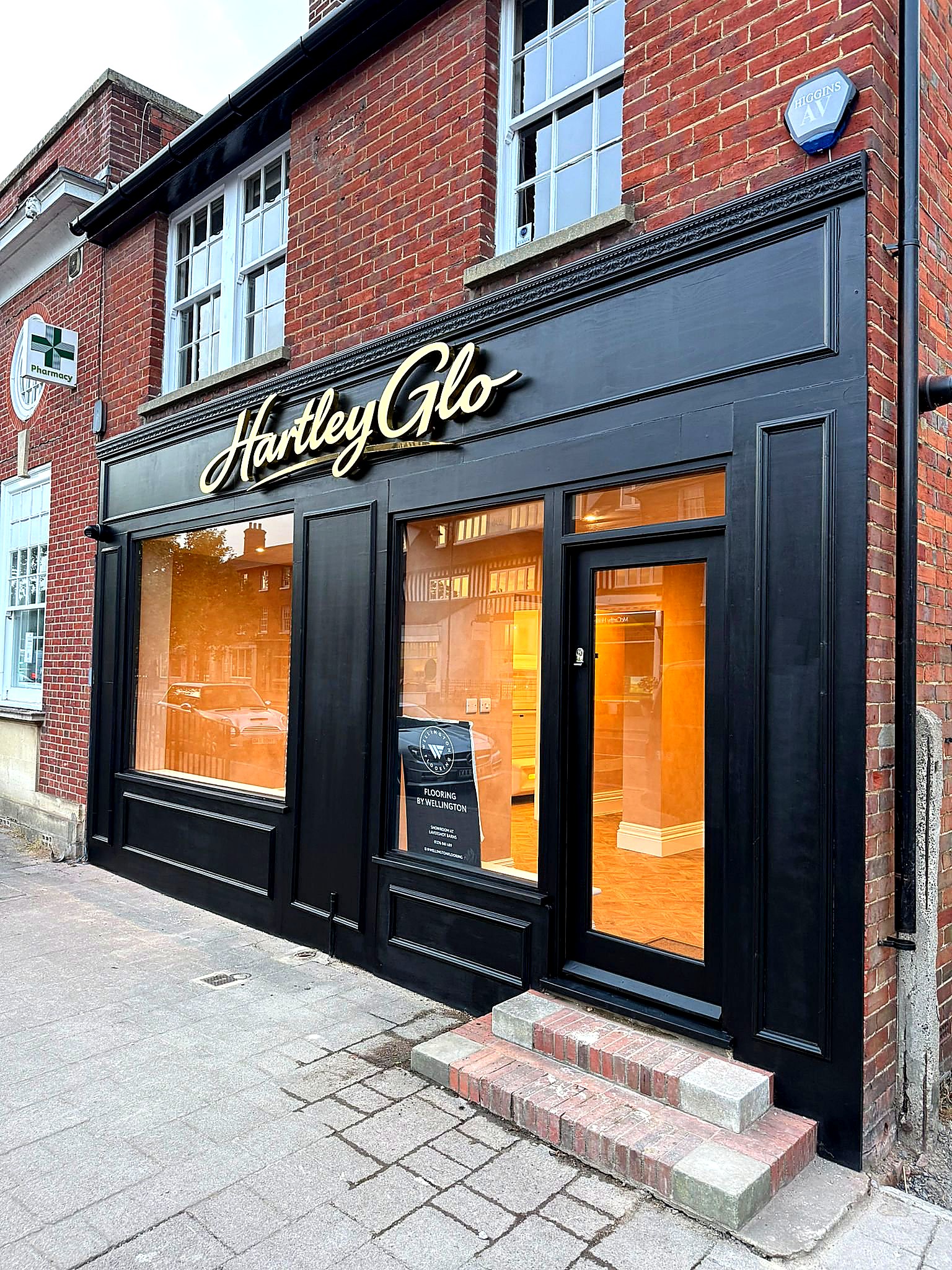 Completed — evening shot with warm interior lighting glowing through the new windows